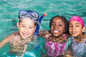 A Boy And 2 Girls Enjoying The Water