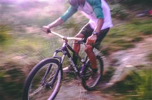 mountain biker going through water